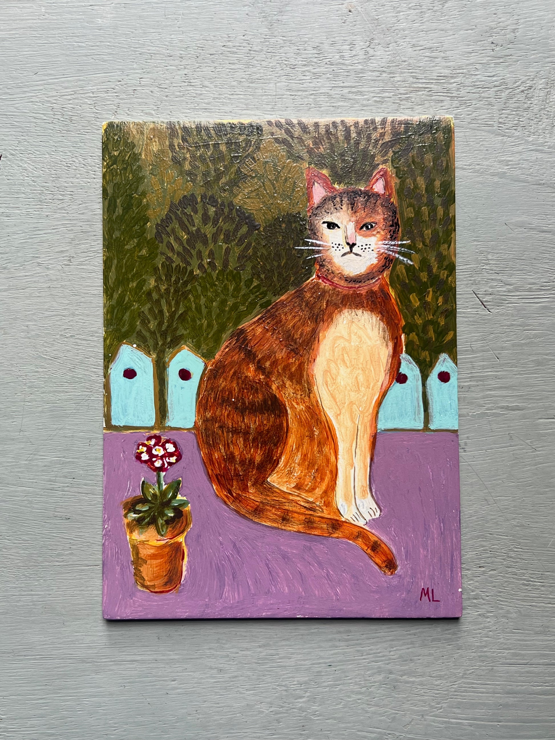 Original acrylic painting of a ginger cat sitting beside a potted flower against a leafy garden background, painted on a small wooden panel in folk art style.