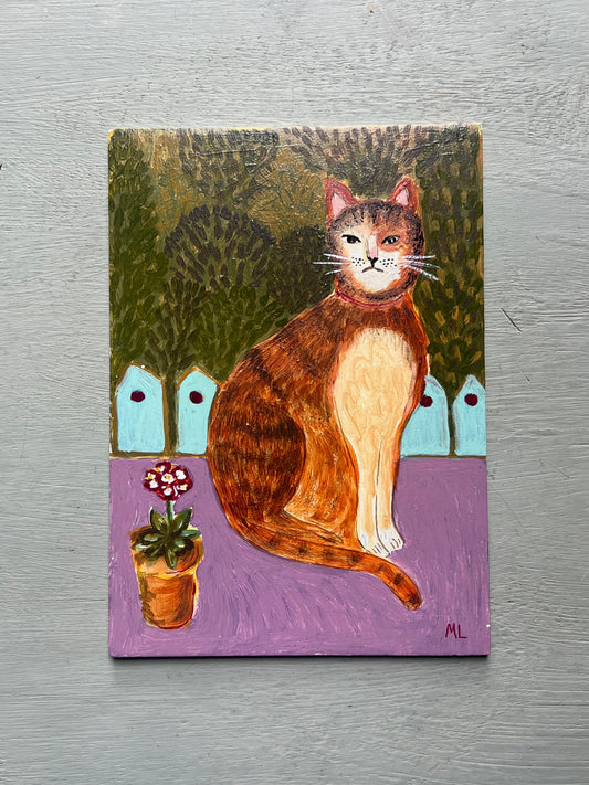 Original acrylic painting of a ginger cat sitting beside a potted flower against a leafy garden background, painted on a small wooden panel in folk art style.