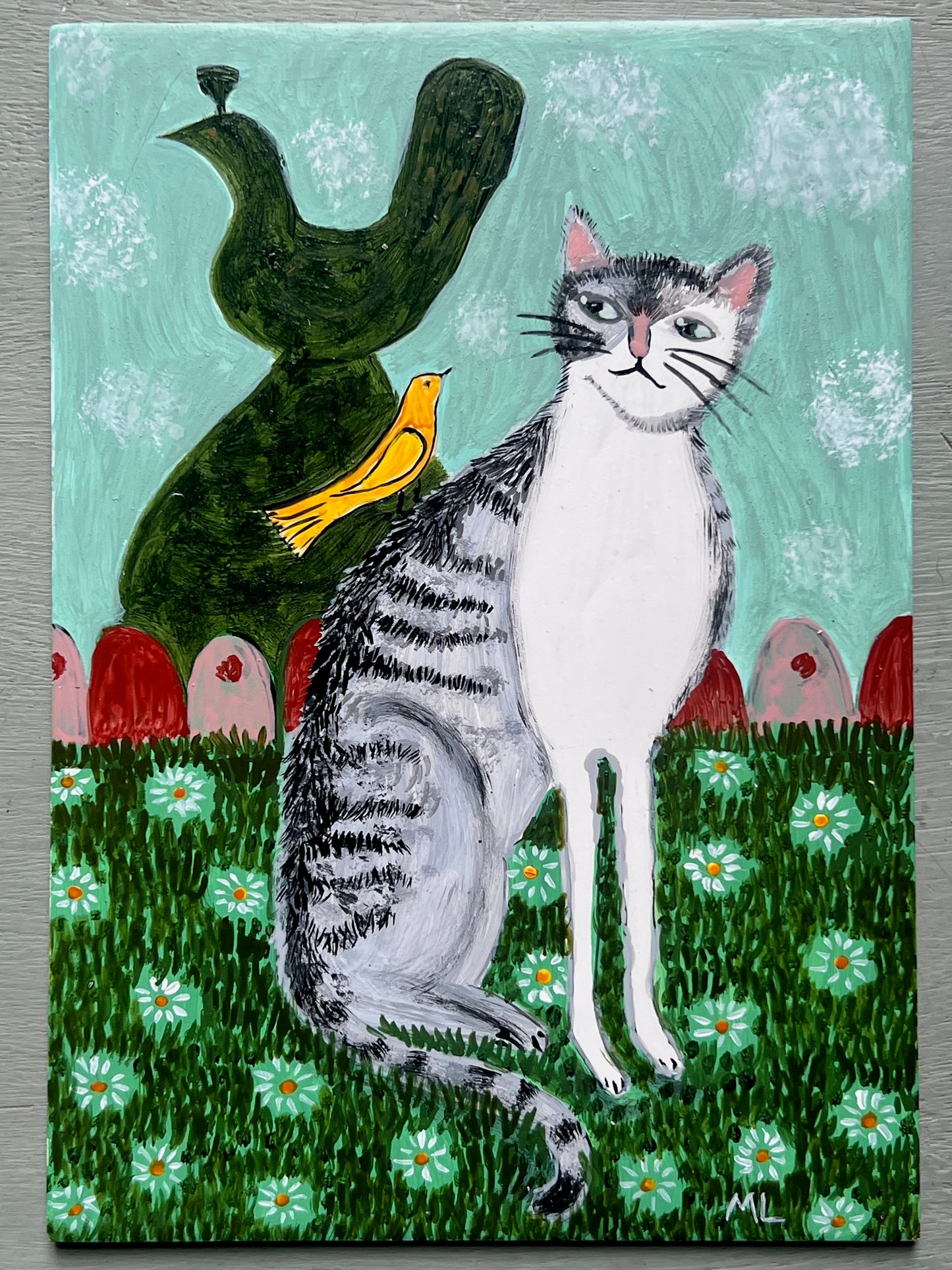Original acrylic painting of a grey tabby cat sitting amongst white daisies beside a yellow bird and dark green ornamental figure against a pale turquoise background, painted on a 5 x 7 inch wooden board.