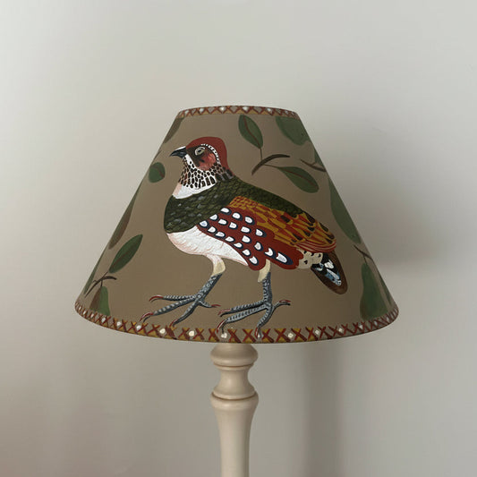 Decorative hand painted lampshade with a partridge design on a plain taupe 
background